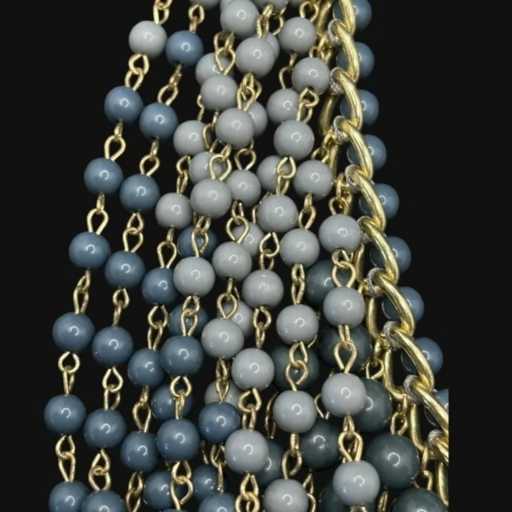 Gold plated cuban link chain with dangling graduated color jasper roundbeads